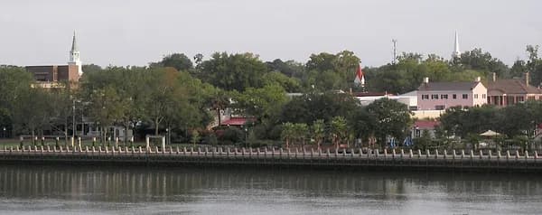 View across the Beaufort River to the seawall of Henry C. Chambers Waterfront Park and the buildings of Bay Street beyond